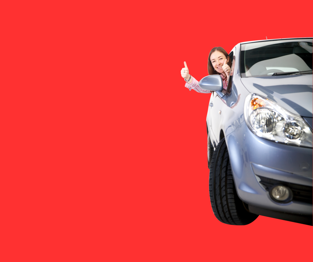 Lady leaning out a car window with her thumb up
